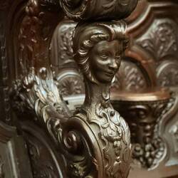 The choir was verily intricately carved out of mahogany, with unique characters throughout.