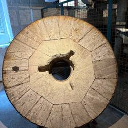 An old granite grinding wheel.