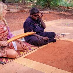 Stick used to throw a ball ... Maruku Dot Painting class — Yulara.