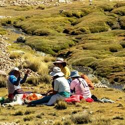 Indigenous woman dehydrating potatoes