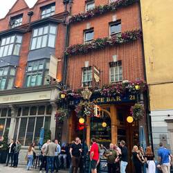 Each pub had a small crowd drinking outside.