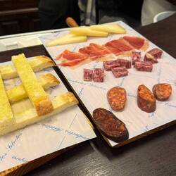 Another example of a meet and cheese selection (house specialties) with toasted bread.