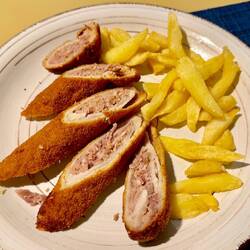 AFlamenquin consists of slices of ham placed on thinly pounded meat then breaded & fried.