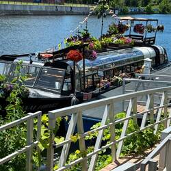 A dinner boat with lots of free flower baskets