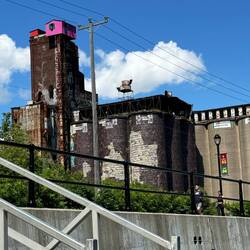 Building falling down around the little house up top
