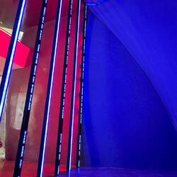 Large moving ticker tape like digital art exhibit. Two stories high.