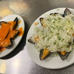Yummy chilled mussels, one dish with a spicy sauce, one with onions and parsley (my favorite).