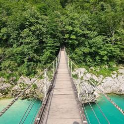 Soca river suspension bridge on walk to waterfall kozjak. Not a heap of faith in it