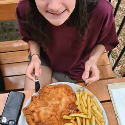 Lucinda's schnitzel. About 4x the serving size of an Aussie pub schnitzel (iPhone for scale)