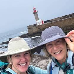Pausing to enjoy a view of a lighthouse.
