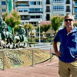 Calvin and a statue of Don Quixote.