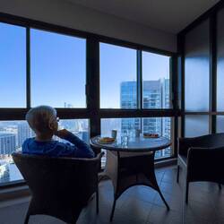 Breakfast on our enclosed balcony at the Meriton Suites — Sydney, NSW.
