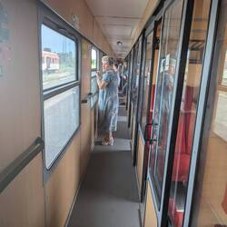 Passengers holding the windows down, trying to get some air