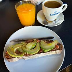 Yummy avocado toast, fresh squeezed orange juice and coffee at our rest stop
