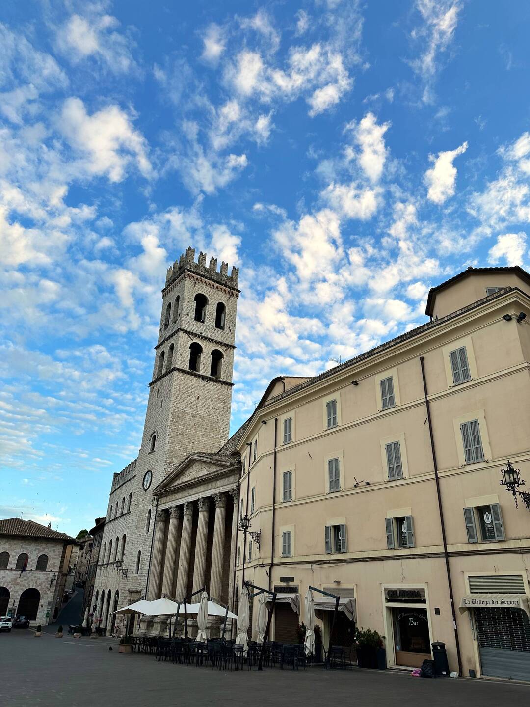 The Torre del Popolo (L) and a church inside an 11th century Roman temple