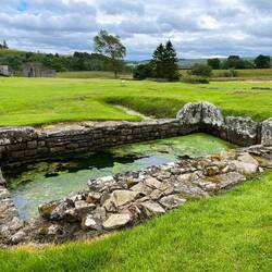 A well, and note the worn stones where many hands /arms had bent over to get water