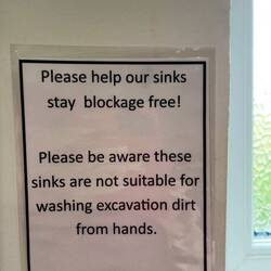 Not the usual warning one sees in bathrooms!
