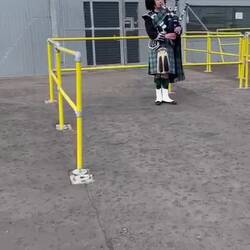 Our ship greeted by a piper.