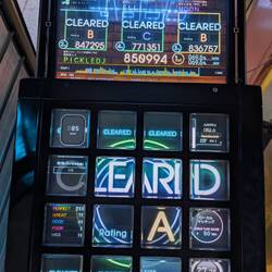 JuBeat is the best rhythm game, Chris got pretty good, Elli got a B, she's never gotten a B before