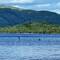 Lake Lomond and the Trossachs National Park. People canoeing and stand up paddle boarding.