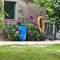 I loved the colors of the flowers, the vase and the hose together.