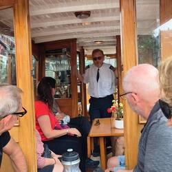 Our captain, on a wooden boat