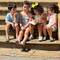 These kids were sitting on the market stairs talking about a book- so cute!