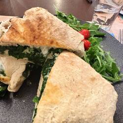 LONG explanation in menu. Basically a fontina/spinach sandwich on traditional unleavened bread. Yum.