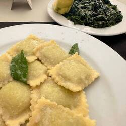 Ravioli filled with spinach and ricotta, dressed with a little butter with sage. wow.