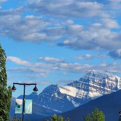 Gate 1 bus park at an alpine community with views of the Rocky Mountains.