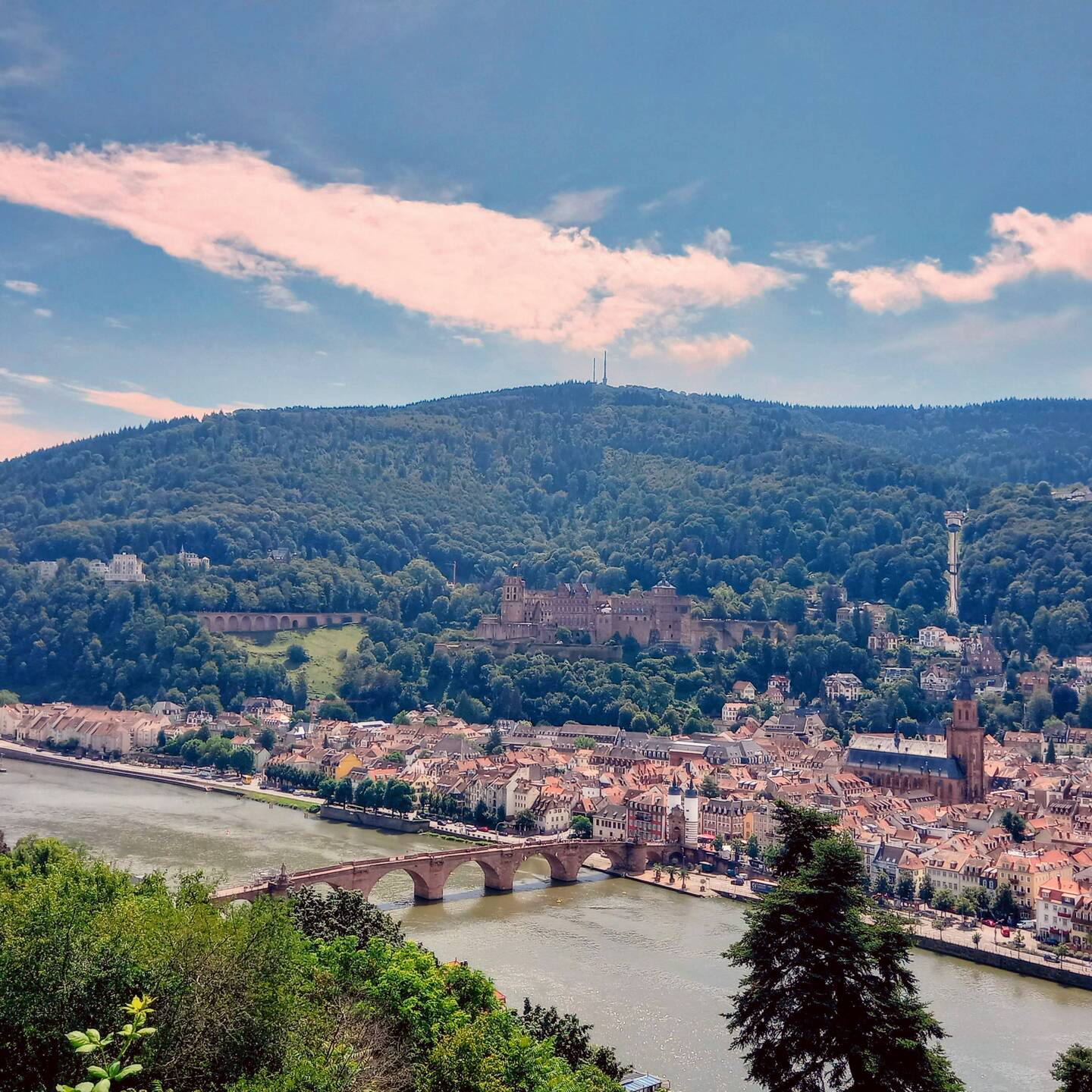 Looking over the Neckar River to Heidelberg Castle with the funicular on the right