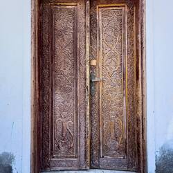 A beautifully carved door in need of TLC — Muscat, Oman.
