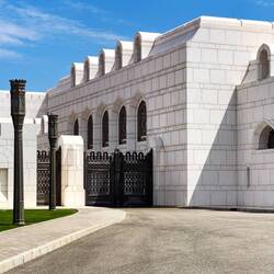The government buildings at the complex are all white — Muscat, Oman.