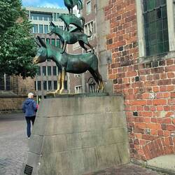 The famous Musicians of Bremen statue. People rub it, hence the golden bits.