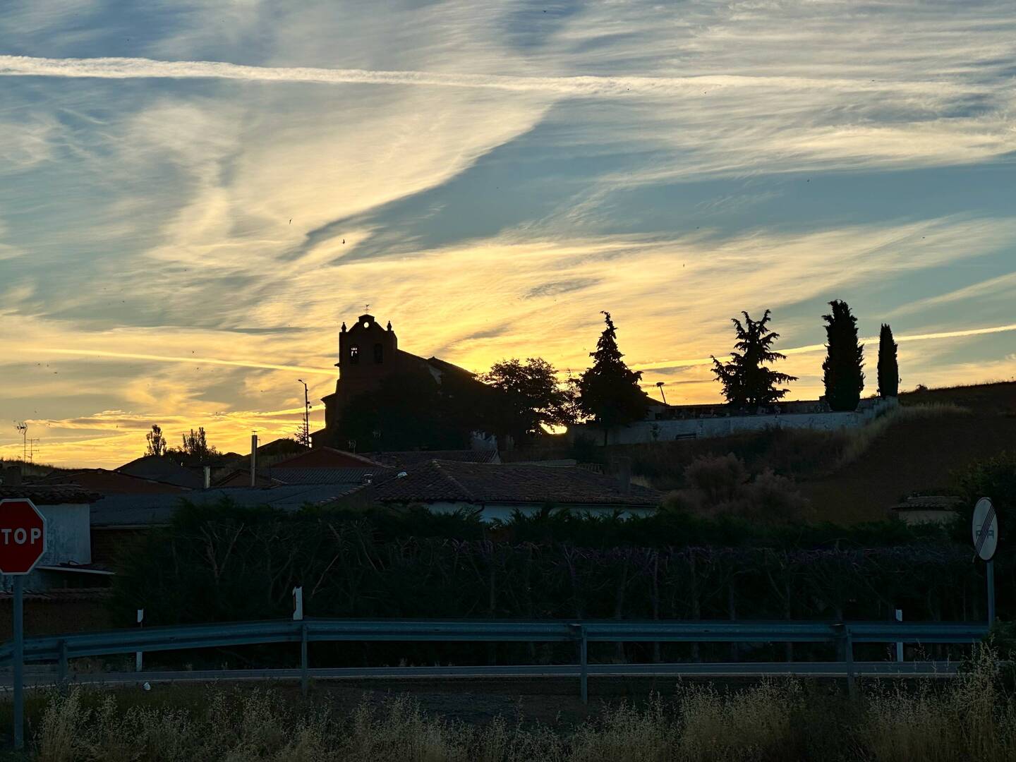 Sun rising behind a small village church. No breakfast available! 👎😕