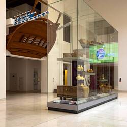 The main foyer of the National Museum includes the replica stern of a galleon — Muscat, Oman.