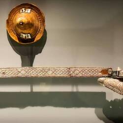 Silver Janbiya (curved, double edged dagger) on a woven belt (circa 1750-1850) & a parrying shield.