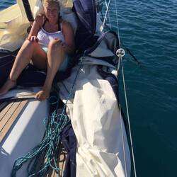 Cath holding down the sail.