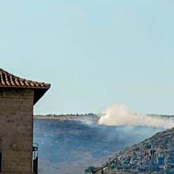 Planes dropping water on hillside, missed the plane