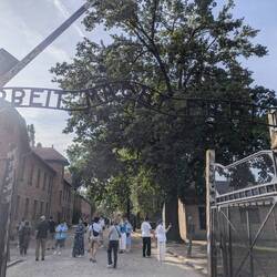 "Arbeit macht frei" = "work sets you free", which is diabolically opposite of what happened here