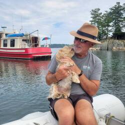 A man his dog and his boat. Life is good.