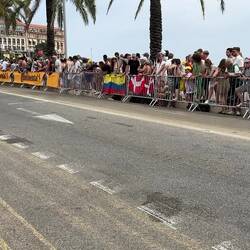 A Tour de France competitor passing the crowd along the Promenade des Anglais.