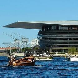 Their Opera house but I was actually taking a photo of the wooden boat in the front