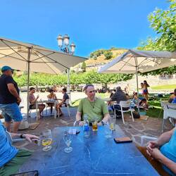 Drink and pizza after the dip in the river, right on it's banks