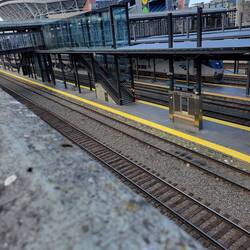 See my train under the bridge and Seahawks stadium behind station