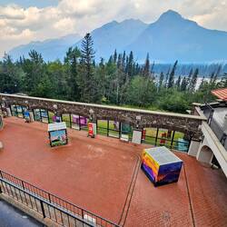 The huge pool area, now covered, with the Bow River and mountains in the background