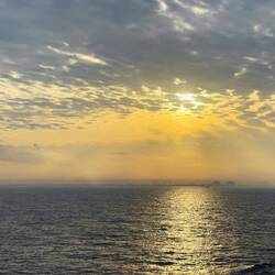 Hazy sunrise on approach to Kochi, India.