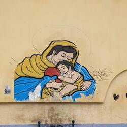 A mother loving feeding her child Coca Cola