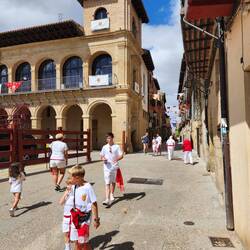Locals dressed in white and red to celebrate the city's saint