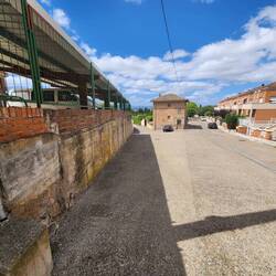 dumpy on left side and townhouses on the right